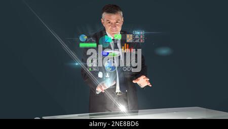 Composition of caucasian businessman touching screen with data processing Stock Photo