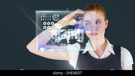 Composition of caucasian businesswoman touching screen with data processing Stock Photo