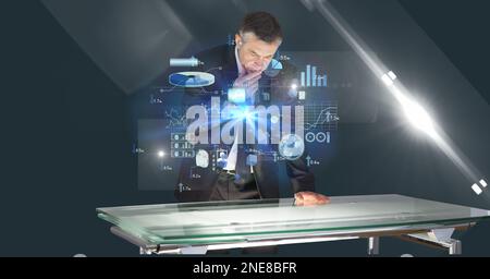 Composition of caucasian businessman touching screen with data processing Stock Photo