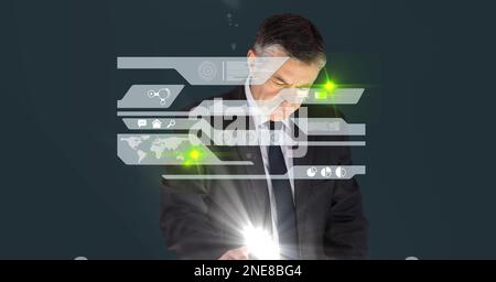 Composition of caucasian businessman touching screen with data processing Stock Photo