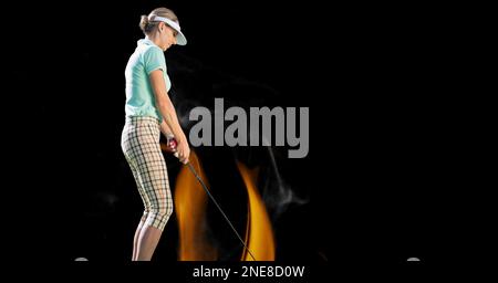 Composition of female golf player over flames on black background. sport and competition concept digitally generated image. Stock Photo