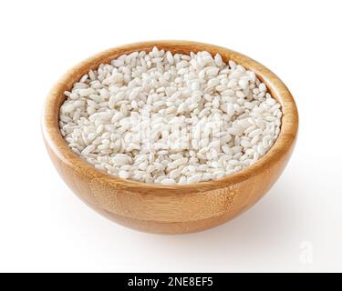 Uncooked arborio rice in wooden bowl isolated on white background with clipping path Stock Photo
