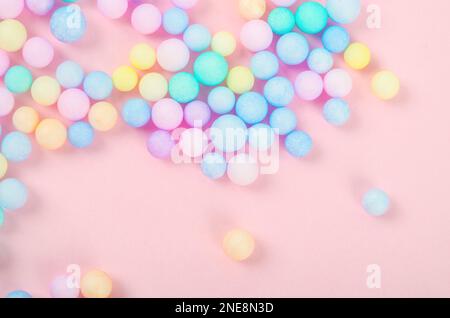 Colorful polystyrene foam on pink background, creativity concepts Stock Photo