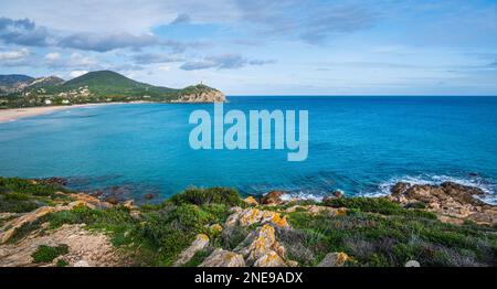 Chia beach, Mediterranean Sea and peninsula with ancient tower Torre di Chia Affioramento Ediacariano. Seascape with rock and cliffs shore, South Sard Stock Photo