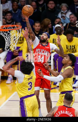 Los Angeles, United States. 15th Feb, 2023. New Orleans Pelicans forward Brandon Ingram (C) shoots between Los Angeles Lakers forwards Anthony Davis (L) and Rui Hachimura (R) during an NBA basketball game in Los Angeles. Credit: SOPA Images Limited/Alamy Live News Stock Photo