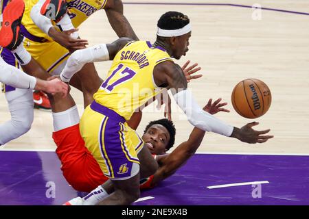 Los Angeles, United States. 15th Feb, 2023. New Orleans Pelicans forward Herbert Jones (Back) passes the ball away from Los Angeles Lakers guard Dennis Schroder (Front) during an NBA basketball game in Los Angeles. Credit: SOPA Images Limited/Alamy Live News Stock Photo