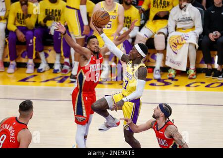 Los Angeles Lakers guard Dennis Schroder (2nd R) goes to basket under pressure from New Orleans Pelicans guard CJ McCollum (2nd L) during an NBA basketball game in Los Angeles. Stock Photo