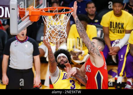 Los Angeles Lakers forward Anthony Davis (L) and New Orleans Pelicans center Willy Hernangomez (R) fight for a rebound during an NBA basketball game in Los Angeles. Stock Photo