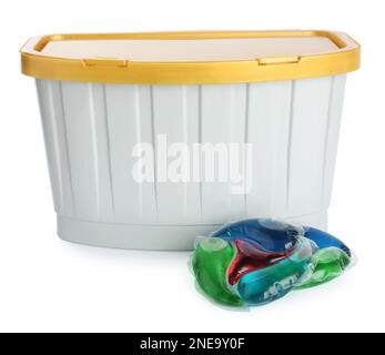 Laundry capsules and box on white background Stock Photo