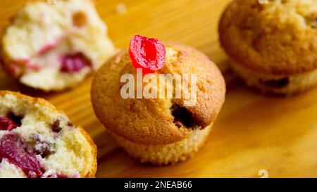 Candied cherry muffins made in a German patisserie. Stock Photo