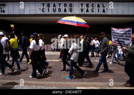 Demonstrators wave and carry Colombian flags during the demonstrations against the reform proposals of Colombian president Gustavo Petro, in Bogota, C Stock Photo