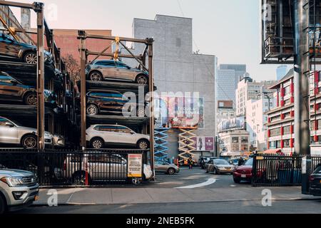 New York, USA - November 21, 2022: Stacked mechanical multi level parking lot in Lower Manhattan, a popular way to park in dense boroughs. Stock Photo