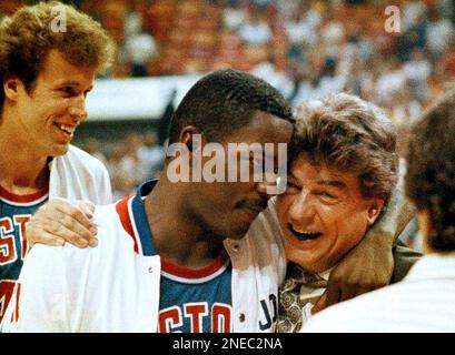 FILE - In this May 13, 1987 file photo, Detroit Pistons coach Chuck Daly  hugs guard Joe Dumars after the Pistons won the second round of the NBA  playoffs, defeating the Atlanta