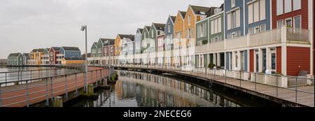 Panorama of famous colorful wooden houses by the Rietplas lake in Houten, Province Utrecht, The Netherlands Stock Photo