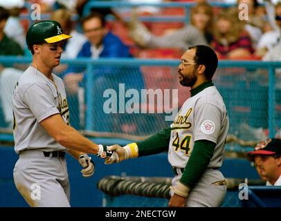 Mark McGwire, left, of Oakland and teammate Dave Stewart, right, confer  with All Star teammate Mickey Tettleton of the Baltimore Orioles, on  Monday, July 11, 1989 during an afternoon practice in Anaheim