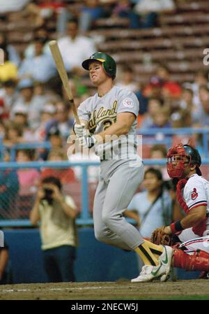 Oakland A?s rookie Mark McGwire, left, watches his third home run