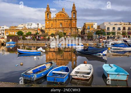 Town of Msida in Malta, St. Joseph Church, Baroque style parish church from 1889 and boats in Msida Yacht Marina. Stock Photo