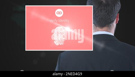 Composition of businessman and screen with biometric fingerprint. global online identity and digital interface concept digitally generated image. Stock Photo