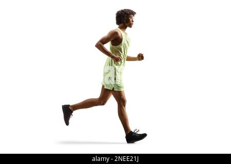 Full length profile shot of an african american guy jogging isolated on white background Stock Photo