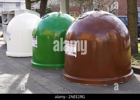 Hannover, Germany - March 17, 2020: Glass collection containers or bottle banks for waste separation and recycling brown, green and clear glass Stock Photo