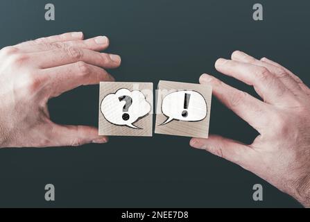 question and answer or communication concept with speech bubbles on wooden blocks Stock Photo