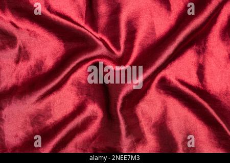 Smooth elegant burgundy silk or satin luxury fabric texture Top view Stock Photo