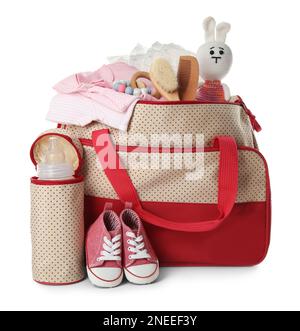 Maternity bag with child's clothes and accessories on white background Stock Photo