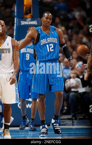 Orlando Magic center Dwight Howard reacts while facing the Denver Nuggets  in the third quarter of the Nuggets' 115-97 victory in an NBA basketball  game in Denver on Wednesday, Jan. 13, 2010. (
