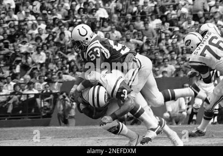 Joe Namath, New York Jets quarterback, leaves the field at Shea Stadium in New  York after the drive against Kansas City Chiefs faltered, Dec. 20, 1969.  Wind, shown kicking up dust around