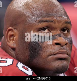 Arizona Cardinals tackle Gabe Watson looks up at the scoreboard in