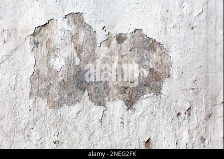 Full frame close-up on an old cement wall with cracked paint. Stock Photo