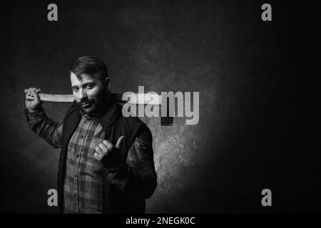 Woodsman with axe. Male strength Stock Photo