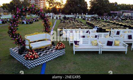 Colorful beautiful flowers indian marriage wedding decorations designs Indian party plot ground Stock Photo