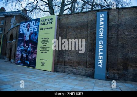 London, UK. 16th Feb, 2023. Advertisement signs seen during the exhibition. From defiant train writers to powerful large-scale muralists. Over 100 international artists are featured in BEYOND THE STREETS LONDON Exhibition at Saatchi Gallery. The exhibition, supported by Adidas Originals, will be the most comprehensive graffiti & street art exhibition to open in the UK, curated & founded by: Roger Gastman. (Photo by Loredana Sangiuliano/SOPA Images/Sipa USA) Credit: Sipa USA/Alamy Live News Stock Photo