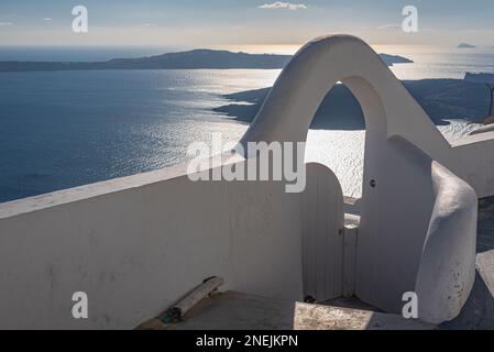 Panoramic view on the caldera from a whitewashed arch, Santorini Stock Photo