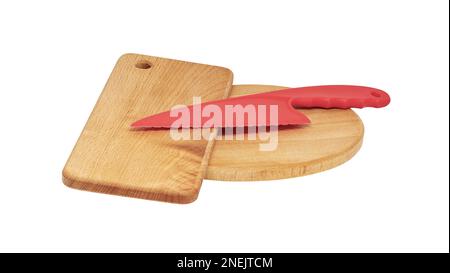 Image of a red plastic knife lies on wooden cutting boards Stock Photo