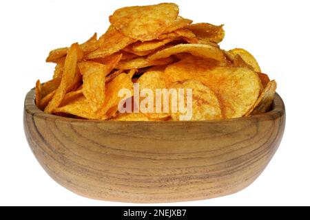 paprika flavored potato chips in a teakwood bowl isolated on white background Stock Photo