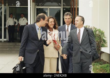 Whitewater figure Susan McDougal smiles as she talks with her attorney ...