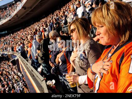 Becky McKernan, wife of Jim McKernan, aka Barrelman, is choked up before a  tribute to Barrelman before the NFL football game between the Denver Broncos  and the Oakland Raiders in Denver on