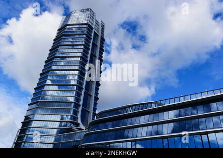 the MOL office tower in Budapest. aluminum curtain wall. reflective glass facade. shiny reflective glass windows. modern architecture. blue sky Stock Photo