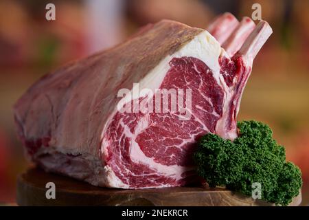 Close Up Of Rib Of Beef On Meat Counter In Butchers Stock Photo