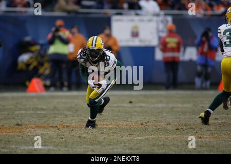 Seattle Seahawks running back Shaun Alexander (37) is tacked by Green Bay  Packers safety Atari Bigby (20) for a 1-yard loss during the first quarter  of the NFC Divisional Playoff at Lambeau