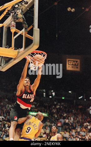 Portland Trail Blazers? Rasheed Wallace (30) dunks over Los Angeles Lakers? Nick Van Exel (9) while Lakers? Kobe Bryant, rear, looks on during the first quarter, Friday, April 24, 1998 in Inglewood, Portland Trail Blazers? Rasheed Wallace (30) dunks over Los Angeles Lakers? Nick Van Exel (9) while Lakers? Kobe Bryant, rear, looks on during the first quarter, Friday, April 24, 1998 in Inglewood,