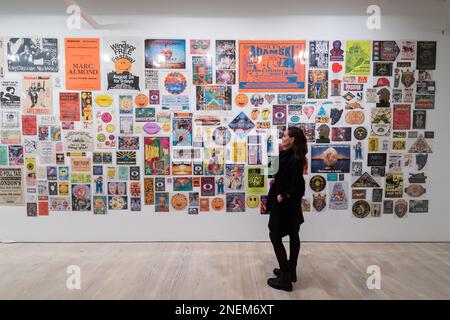 London, UK. 16th Feb, 2023. LONDON, UNITED KINGDOM - FEBRUARY 16, 2023: A gallery staff member looks at The Mott Collection: Wall if Noise 1976 - 2000 by Toby Mott during a press view for Beyond The Streets, the most comprehensive graffiti & street art exhibition to open in the UK, at Saatchi Gallery in London, United Kingdom on February 16, 2023. The exhibition (17 February - 9 May 2023) will feature works of over 100 artists spread over all three floors of London's iconic Saatchi Gallery. (Photo by WIktor Szymanowicz/NurPhoto) Credit: NurPhoto SRL/Alamy Live News Stock Photo