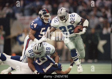 New York Giants defenders (91) Justin Tuck and (97) Kenderick Allen  celebrate a Dallas Cowboys turnover in week 13 at Giants Stadium in East  Rutherford, New Jersey on December 4, 2005. The