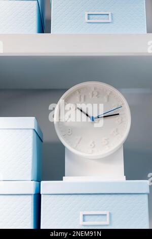 Closeup on the pointers of a clock marking ten minutes past ten. The main focus is on the number ten and its pointer.Smiling Analog clock.time Stock Photo