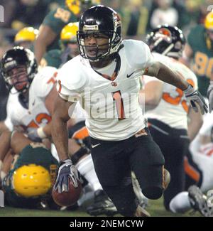 Oregon State's Jacquizz Rodgers (1) scores against Oregon's Spencer  Paysinger (35) during the first half of an NCAA college football game in  Eugene, Ore., Thursday Dec. 3, 2009. Oregon beat Oregon State