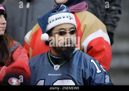 A Seattle Seahawks fan wears holiday attire before an NFL football game  against the Arizona Cardinals, Sunday, Dec. 22, 2019, in Seattle. (AP  Photo/Elaine Thompson Stock Photo - Alamy