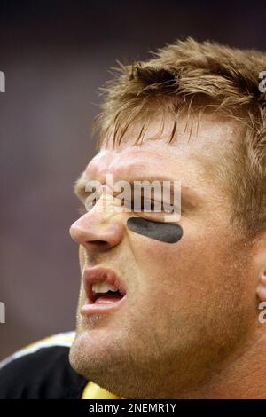 New Orleans Saints line backer Troy Evans (54) holds up a Champion towel  after the Saints defeated the Indianapolis Colts 31-17 in Super Bowl XLIV  at Sun Life Stadium in Miami on