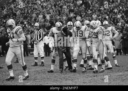 Baltimore Colts end Raymond Berry snags a pass from quarterback John Unitas  for a five-yard gain as the Colts and the Detroit Lions tangled, Sept. 30,  1962 in Baltimore, Md. Defensive halfback